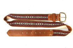 Laredo Unisex Leather Belt in Red by SouldierSouldier belts are made of high-end waxed leather coupled with our 'Laredo' fabric and manufactured in the USA.  The same fabric seen on our famous guitar straps is now available in a high-end unisex belt.  The Souldier name is branded into the belt loop and secured with nickel rivets.  All nickel hardware on the belt and available in even numbered sized from 28 to 42. The measurements reflect the minimum and maximum length of each belt size. Please c Brown Leather Belt With Embroidery, Adjustable Embroidered Leather Belt, Brown Embroidered Leather Belt, Traditional Leather Belts For Festivals, Jimi Hendrix Woodstock, Famous Guitars, Boutique Guitar, Guitar Straps, Candy Apple Red