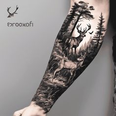 a man's arm with a deer and forest scene tattoo on the left forearm