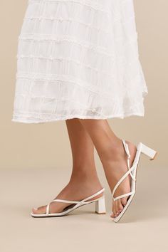 Subtly sultry and always chic, the Lulus Kerrie White Satin Strappy Low Heel Sandals will add a luxe to touch to any ensemble! Sleek woven satin shapes these unforgettable heels that have a square footbed, a thong-style upper, and a network of slender straps throughout. A matching, adjustable slingback strap secures with a shiny gold buckle, all atop cute block heel. 2" wrapped block heel. Cushioned insole. Felted rubber sole has nonskid markings. Man made materials. Imported. Lulus | Kerrie Whi White Sandal, Low Heel Sandals, Bridesmaid Shoes, Cute Heels, Sandal Heels, White Sandals, Heel Sandal, Slingback Sandal, White Satin