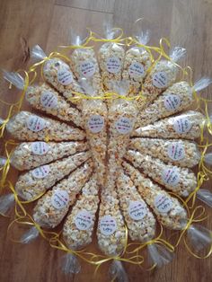 a bunch of bags filled with popcorn on top of a wooden floor