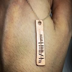 This is a beautiful solid copper pendant which has been hand stamped with your chosen name in ancient Ogham alphabetPLEASE BE AWARE THE ESTIMATED DELIVERY DATE IS GIVEN BY ETSY AND NOT ME AS A SELLER. IT IS JUST AN ESTIMATE AND DOES NOT TAKE ONTO ACCOUNT BUSY PERIODS OR ANY DELAYS THAT MAY OCCUR WHICH IS ENTIRELY OUT OF MY HANDS. Symbolic Engraved Copper Jewelry, Symbolic Stamped Necklace For Anniversary, Symbolic Copper Jewelry Gift, Symbolic Stamped Necklace For A Gift, Symbolic Stamped Necklace For Gift, Symbolic Copper Jewelry For Gifts, Symbolic Copper Jewelry As Gift, Stamped Pendant Jewelry For Anniversary Gift, Symbolic Hand Stamped Jewelry Gift