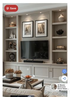 a living room filled with furniture and a flat screen tv on top of a entertainment center