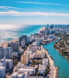 an aerial view of the beach and ocean in miami, florida with high rise buildings