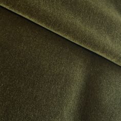 a close up view of a green fabric