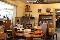 a room filled with lots of wooden furniture and decor on top of it's walls