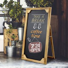 a chalkboard sign with coffee time written on it