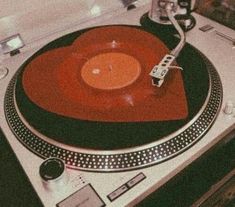 a turntable with a red disc on it