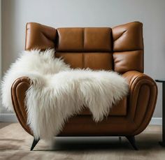 a brown leather chair with white fur on it