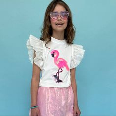 Adorable T-Shirt Featuring A Vibrant Beaded Flamingo Design. Decorated With Sparkling Sequins For A Playful And Eye-Catching Look. Soft Ruffle Sleeves Add A Touch Of Elegance And Fun. Made From Comfortable And Breathable Fabric, Perfect For All-Day Wear. Ideal For Casual Outings, Playdates, And Adding A Pop Of Color To Any Outfit. Material & Care: Fabric: High-Quality Cotton Blend With Sequin Embellishments. Care Instructions: Hand Wash Cold. Lay Flat To Dry. Do Not Bleach Or Iron Directly On Th Pink Ruffled T-shirt For Spring, Cute Pink Ruffled T-shirt, White Ruffled T-shirt For Summer, Trendy Ruffled T-shirt For Summer, White Ruffled T-shirt For Spring, Trendy Summer Ruffled T-shirt, Trendy Summer T-shirt With Ruffles, Casual Flamingo Print Tops For Spring, Playful White Summer Tops