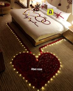 a bed with lights on the floor and a hello kitty sign in the middle of it