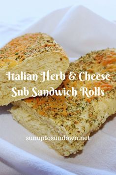 two pieces of italian herb and cheese sub sandwich rolls on a white napkin with the words, italian herb & cheese sub sandwich rolls