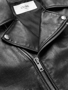 CELINE HOMME's Mr Hedi Slimane is well-versed in the art of the biker jacket and this one is as good as it gets. Cut from supple leather, it's detailed with polished silver-tone hardware and fitted with a smooth lining for easy layering. The multitude of zipped pockets and buckled waist belt are hallmarks of traditional styles. Wear it with: CELINE HOMME Shirt, CELINE HOMME Boots, CELINE HOMME Sunglasses, CELINE HOMME Necklace. Punk Leather Biker Jacket With Zipper, Edgy Leather Jacket For Biker Events, Edgy Leather Biker Jacket For Biker Events, Leather Edgy Biker Jacket For Biker Events, Nike Summer Shoes, Sunglasses Celine, Leather Jacket For Men, Tom Ford Bag, Hedi Slimane