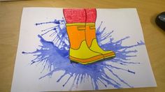 a drawing of a pair of yellow rain boots on top of a piece of paper