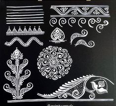 a black board with white designs on it