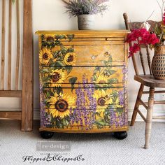 an old dresser has sunflowers painted on it