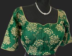 Bottle green Pure silk Blouses comes stitched at 36 and can go upto 42/43 , alterations to the blouse can be requested at the time of purchase to the body and sleeve.   blouse- with hand embroidered designs on neck and sleeve . sleeve -11 inches. well made blouses begins size 36 goes up to 44 . Lined padded blouses. Ships from Texas 💐 Elegant Green Blouse Piece With Resham Embroidery, Green Resham Embroidered Top For Wedding, Elegant Green Art Silk Choli, Green Bollywood Blouse With Intricate Embroidery, Bollywood Style Green Blouse With Intricate Embroidery, Elegant Green Blouse With Floral Embroidery, Green Floral Embroidered Blouse Piece For Wedding, Fitted Green Embroidered Traditional Wear, Green Semi-stitched Blouse Piece With Intricate Embroidery