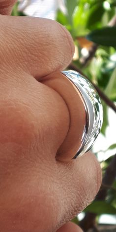 "Statement Dome Ring, Sterling Silver, Minimalist Ring, Designer Unique Style Ring, Wide Domed Ring, Chunky Dome Ring, Wide Band Ring Modern and Chic in Design, this Statement Dome Ring is stunning. Perfect on it's own and just may be the only ring you need. Handmade Sterling Silver Ring with polished finish ✔~ 100% Handmade ~ ✔~ 100% 925 Sterling Silver ~ ✔~ Height 6.3 MM ~ \"the upper part\" ~ ✔~ Width 11.0 MM ~ \"the upper part\" ~ ✔~ Length 25.0 MM ~ \"the upper part\" ~ ✔~ Weight 15.0 grams Adjustable Polished Dome Ring For Promise, Adjustable Polished Dome Ring For Promises, Modern Hypoallergenic Round Band Rings, Sterling Silver Stackable Dome Ring, Stackable Sterling Silver Dome Ring, Adjustable Minimalist Wide Band Ring, Modern Wide Band Ring As Gift, Gift Wide Band Ring With Polished Finish, Silver Rings With Shiny Finish For Everyday