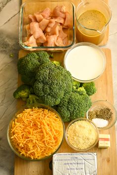 broccoli, cheese, chicken and other ingredients on a cutting board next to bowls