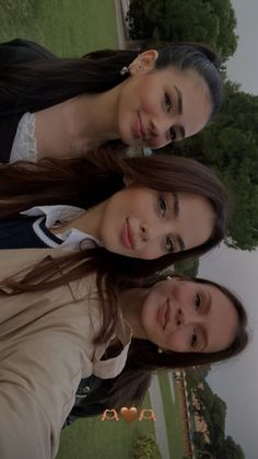 three young women standing next to each other