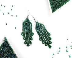 Green Dangling Bead Chandelier Earrings, Green Dangle Earrings With Tiny Beads, Elegant Green Long Drop Beaded Earrings, Green Tassel Drop Earrings With Colorful Beads, Green Tassel Drop Earrings, Green Beaded Long Drop Jewelry, Green Tassel Drop Earrings As Gift, Green Chandelier Earrings With Dangling Beads As A Gift, Green Beaded Drop Tassel Earrings