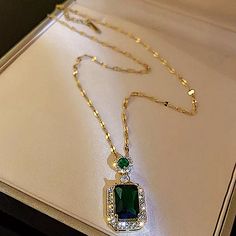 Gold Plated Emerald Green Pendant Necklace Measures 45cm. Please Message Me If You Need A Different Size Necklace. Diamond Simulated Emerald Green Gemstone Cubic Zirconia Elegant Long Rhinestone Clavicle Necklace, Elegant Gold Emerald Necklace For Party, Elegant Green Pendant Chain Necklace, Elegant Green Clavicle Chain Necklace, Elegant Green Pendant Necklace, Elegant Green Chain Necklace For Formal Occasion, Green Crystal Clavicle Chain Necklaces, Gold Square Pendant Necklace For Party, Green Crystal Clavicle Chain Necklace