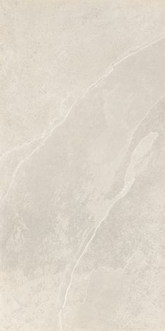 a white marble textured wallpaper with light grey streaks on the top and bottom