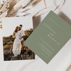 an image of a couple standing next to each other on top of a white table