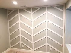 a room that has been painted with white paint and some lines on the wall behind it