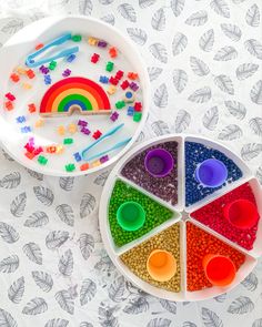 two bowls filled with different colored beads next to each other on top of a table