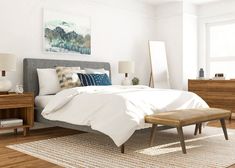 a bed with white sheets and pillows in a bedroom next to a dresser, mirror and lamp