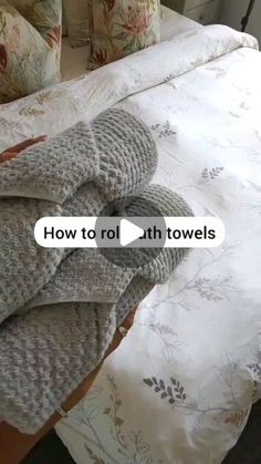 an unmade bed is shown with the words how to rollthrowels on it