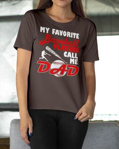 a woman wearing a t - shirt that says, my favorite baseball player calls me dad