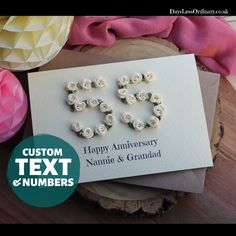 an anniversary card with flowers on it