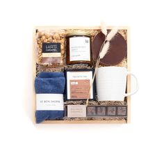 the coffee gift box includes two mugs, cookies and other items to give as gifts