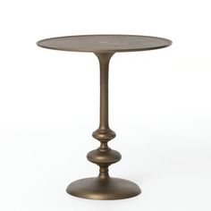 a small round metal table on a white background