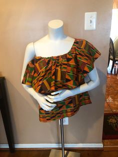 Make a style statement in this gorgeous Kente off Shoulder Top. Top has a comfortable elastic band at shoulder line . A very comfortable fit for all sizes. Multi Wear. Size - Small, Medium large and Extra large Comes with a head wrap Chic Multicolor One-shoulder Top, Chic One-shoulder Multicolor Top, Fitted Multicolor One Shoulder Top, Ankara Off Shoulder Top, Off Shoulder Top, Top Top, Head Wrap, Style Statement, Off Shoulder Tops