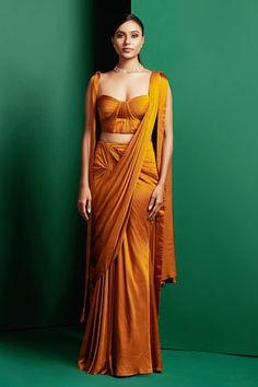 Yellow plain pre-draped saree  in a pleated and draped silhouette. Comes with pleated short corset. - Aza Fashions Pre-draped Silk Sets, Pre-draped Wedding Sets, Festive Pre-draped Fitted Sets, Fitted Draped Evening Sets, Fitted Draped Silk Set, Reception Draped Sets, Fitted Sets With Draped Sleeves For Wedding, Fitted Wedding Sets With Draped Sleeves, Fitted Pre-draped Sets For Reception