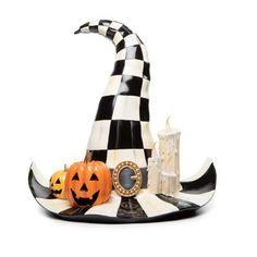 a black and white checkered hat with pumpkins