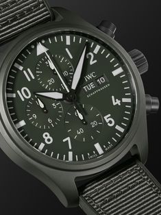 This 'Pilot's Top Gun Woodland' reference is inspired by IWC SCHAFFHAUSEN's military roots, with its dark-green ceramic case and matching rubber and webbing strap. Designed to withstand fluctuating temperatures and breakneck speeds, it has a chronograph dial detailed with luminescent hands and indices and a Swiss-made calibre 69380 automatic movement that has been designed in-house. For warranty information, please refer to details & care Iwc Schaffhausen, Rubber Watches, Summer Sunglasses, Webbing Strap, Green Ceramics, Fine Jewelry Designers, Luxury Gifts, Luxury Watch, Chronograph Watch