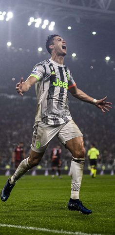 the soccer player is celebrating his goal on the field