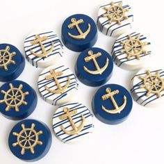 blue and white striped buttons with gold anchors on them