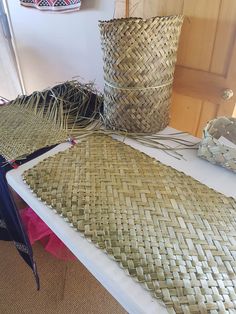 two large baskets sitting on top of a table