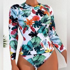 Two-Piece Tropical Long Sleeve Surfing Swimsuit * Size: X-Large (12) * Tropical Print * Multicolor * High Neck-Round Neck * Surfing Style Swimsuit * Long Sleeve * High Stretch * Swimsuit Fabric * 82% Polyester 18% Elastane * Machine Wash, Do No Dry Clean * Wash With Soft Detergent * Not Sheer Long Sleeve Floral Print Swimwear For Surfing, White Stretch Surfing Bodysuit, White Long Sleeve Bodysuit For Poolside, White Printed Swimwear For Surfing, White One-piece Swimwear For Surfing, White Long Sleeve Surfing Bodysuit, Green Long Sleeve Bodysuit For Beach, Green Long Sleeve Bodysuit For The Beach, White Long Sleeve Bodysuit For Vacation