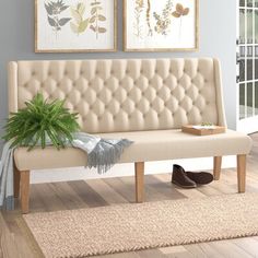 a living room scene with focus on the bench and rugs in the foreground