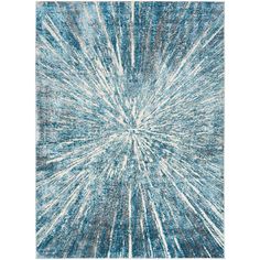 a blue and white rug with an abstract design