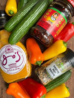 several different types of vegetables and seasonings on a wooden surface with the word ginger written below them