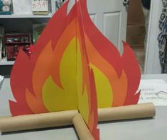 a paper fire is sitting on top of a table