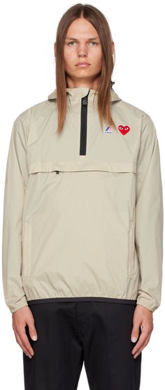 Packable nylon ripstop jacket. · Bungee-style drawstring at hood and hem · Half-zip closure · Embroidered logo patch at chest · Logo printed at chest and back · Packs into zip pockets · Elasticized hem and cuffs · Unlined Part of the Comme des Garçons Play x K-Way collaboration. Supplier color: Beige Clothes Wishlist, Play Comme Des Garcons, K Way, Comme Des Garcons Play, Mens Activewear, Comme Des Garcons, Luxury Streetwear, Half Zip, Patch Logo