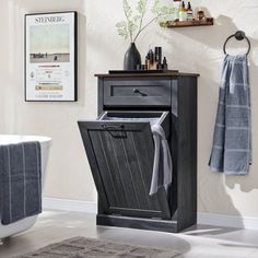 a bathroom with a sink, towel rack and bathtub