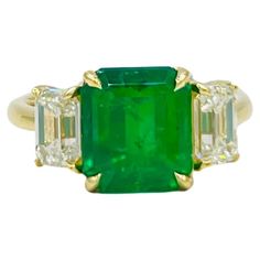 Gorgeous 3.69 ct. Colombian emerald emerald cut with two 1.81 ct. J VVS2 white diamond emerald cuts. Handmade in 18k yellow gold. Ring size 6.75. AGL and GIA certificates included. Three Stone Ring, Colombian Emeralds, 18k Yellow Gold Ring, Emerald Jewelry, Art Deco Interior, Emerald Cut Diamonds, Three Stone Rings, Yellow Gold Ring, Three Stone